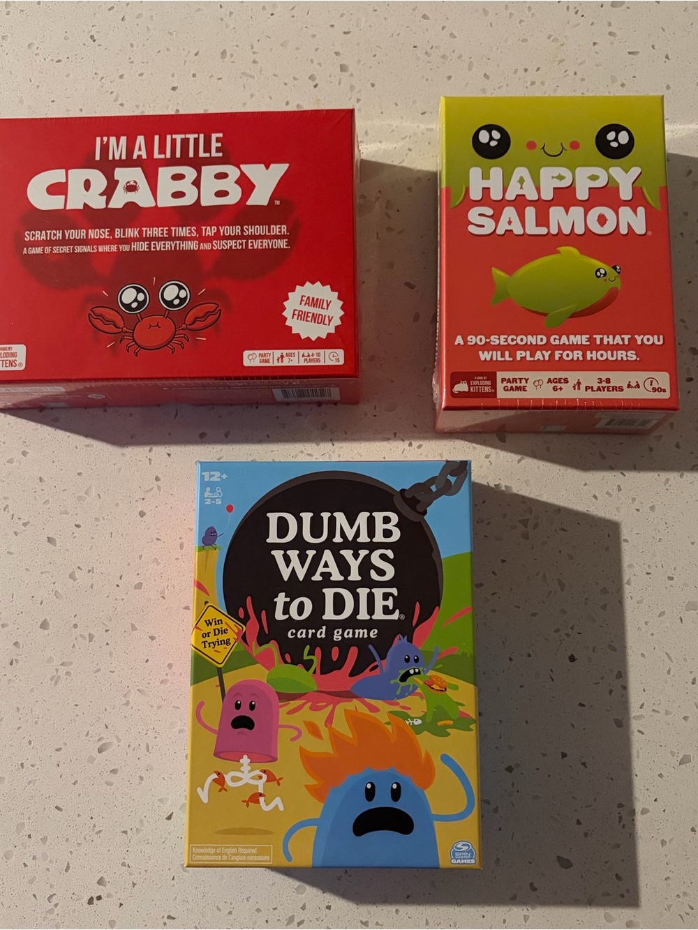 Dumb Ways to Die Card Game Box - Black with Red & Blue Accents